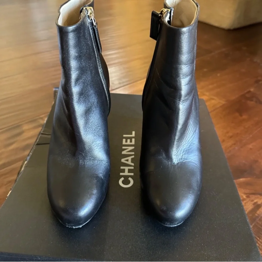 CHANEL Black Leather Wedge Boots with Gold Accent